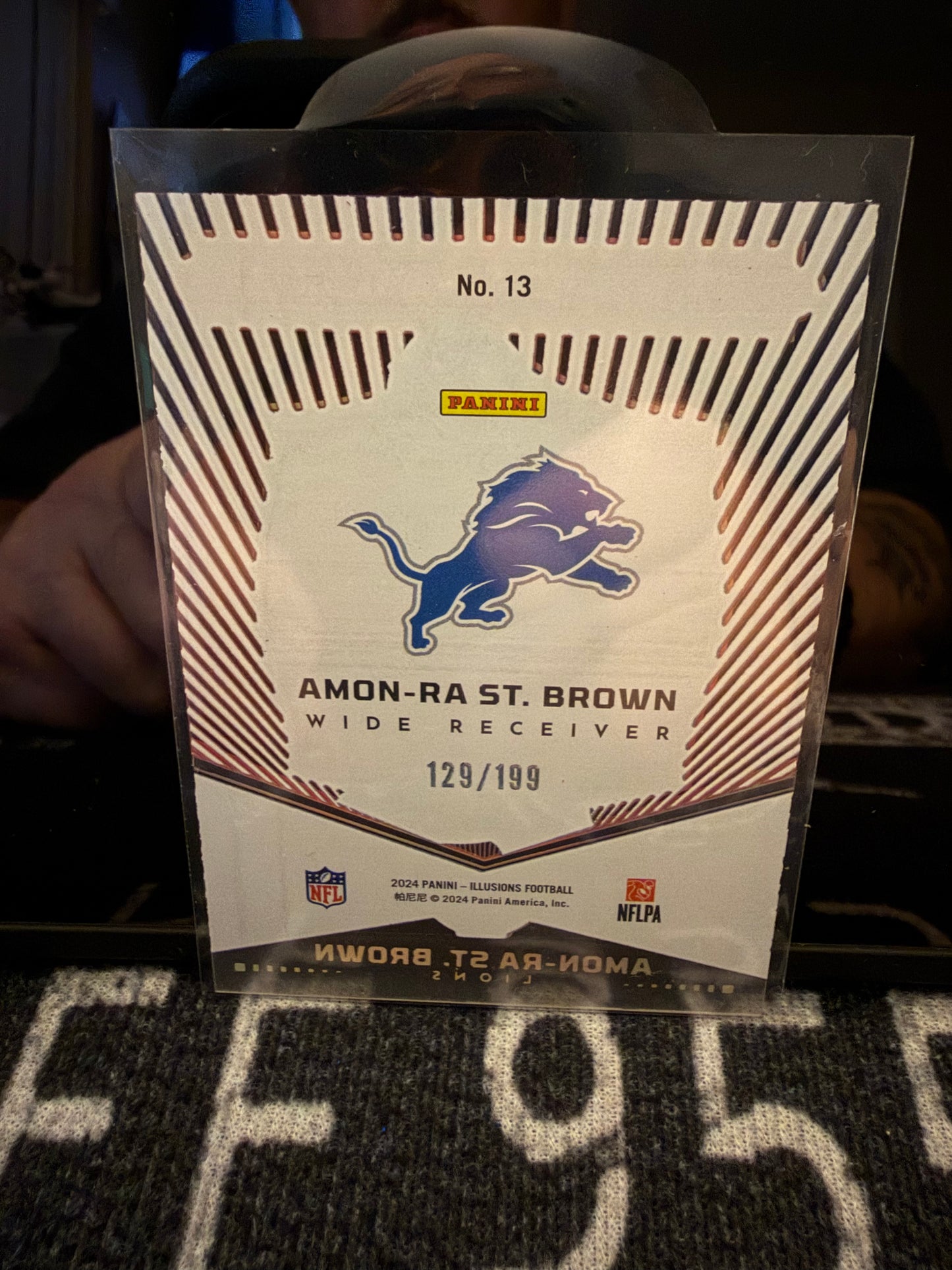 Amon-Ra St. Brown 2024 Panini Illusions Abracadabra Acetate /199 Lions #121/199