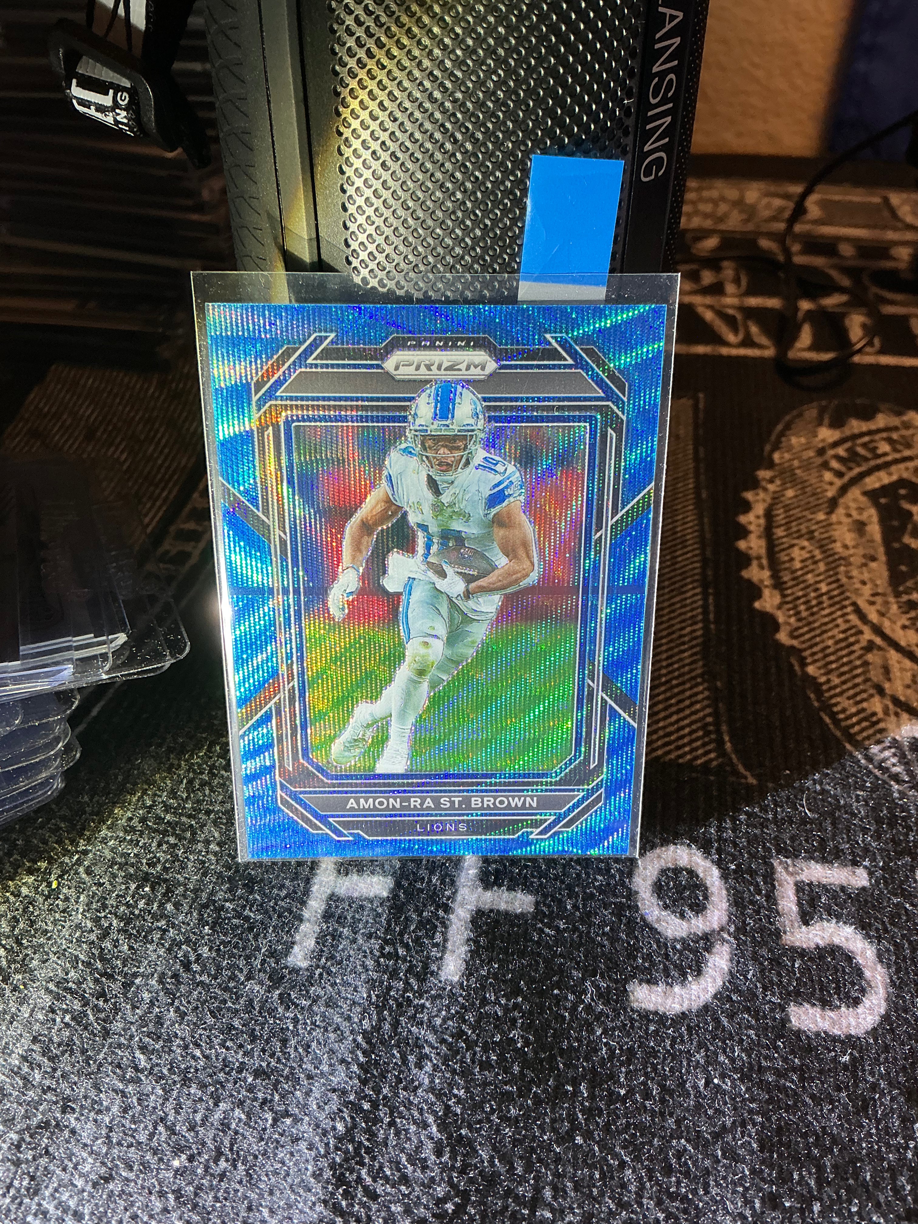 Amon-Ra St. Brown Prizm Blue /199 – Lions Star