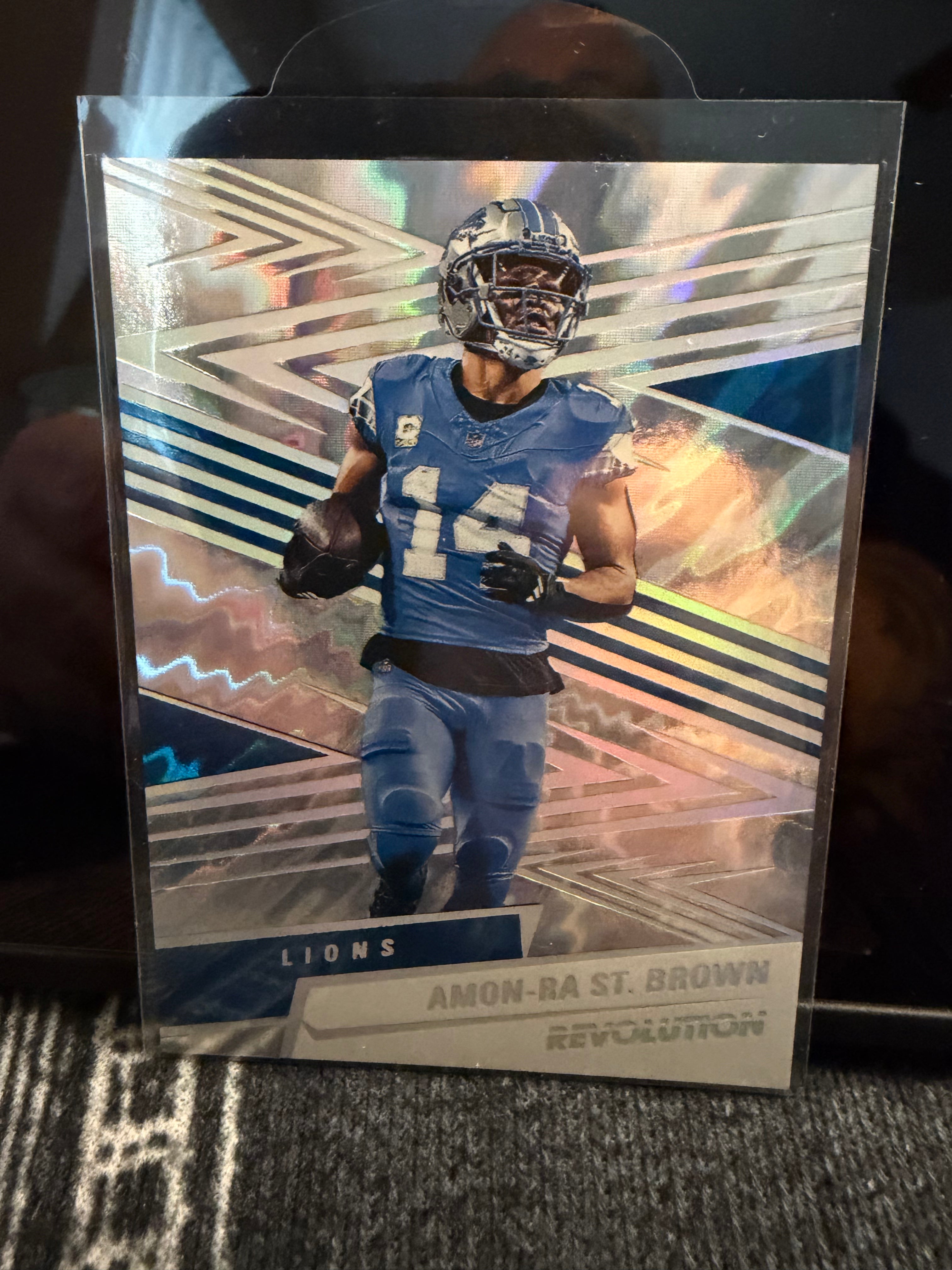 Amon-Ra St. Brown 2025 Panini Revolution Lightning Parallel 25/60 Detroit Lions
