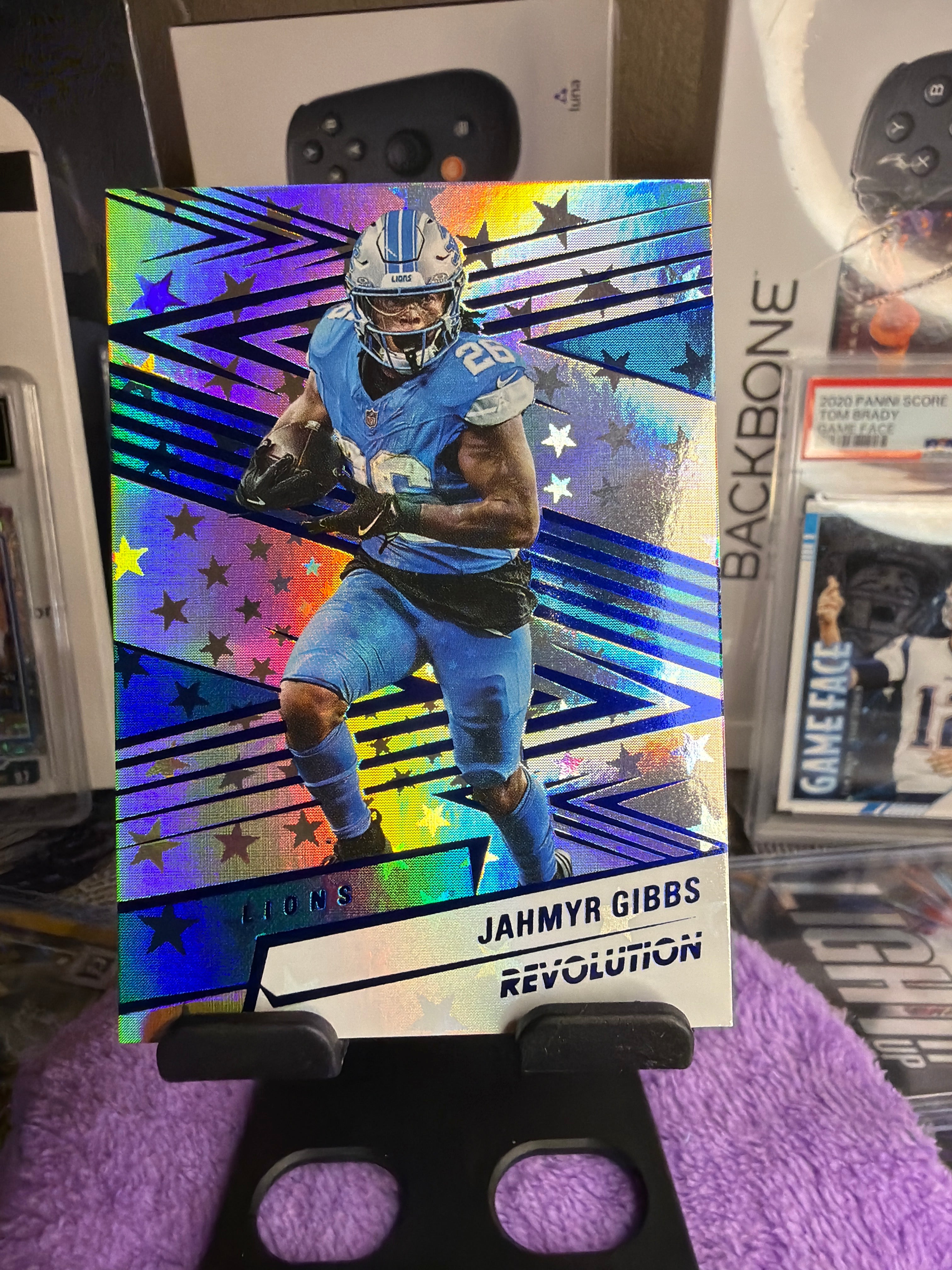 Jahmyr Gibbs 3-Card Numbered Lot – 05/50 Midfield Ticket + 24/49 Revolution Gold + 087/549 Revolution Cosmic