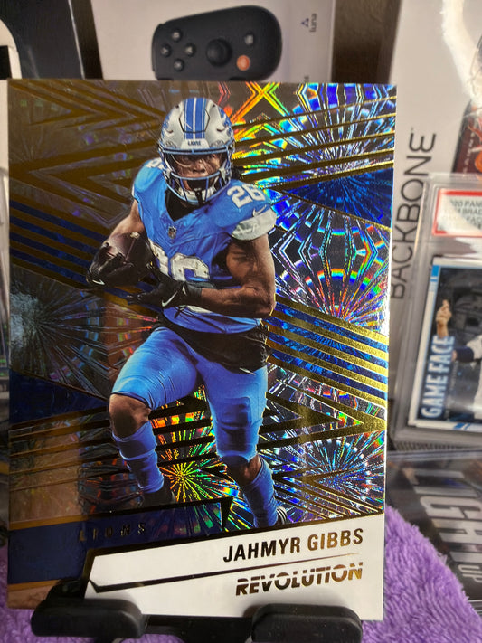 Jahmyr Gibbs 3-Card Numbered Lot – 05/50 Midfield Ticket + 24/49 Revolution Gold Fireworks + 087/549 Revolution Cosmic