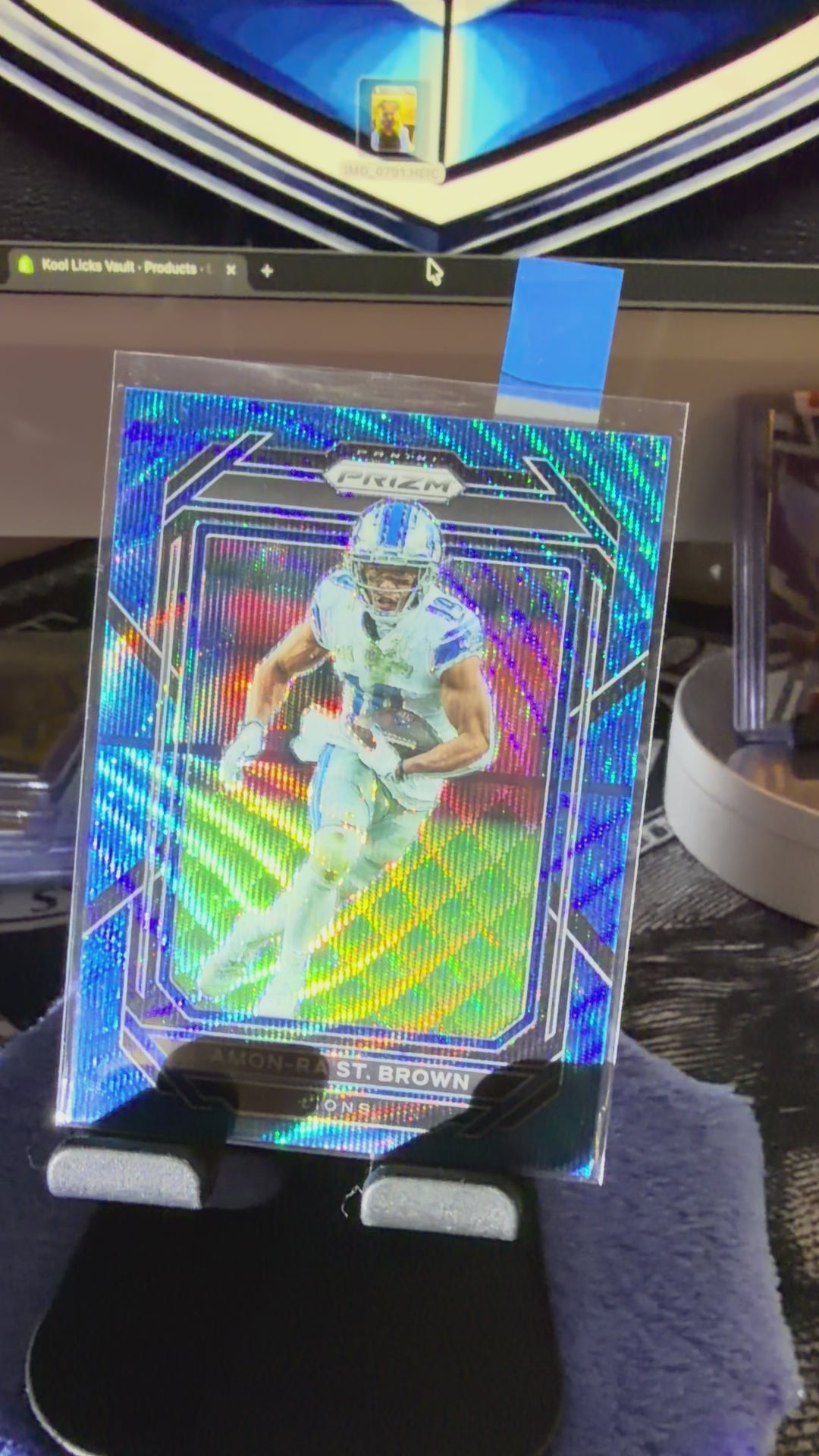 Amon-Ra St. Brown Prizm Blue /199 – Lions Star